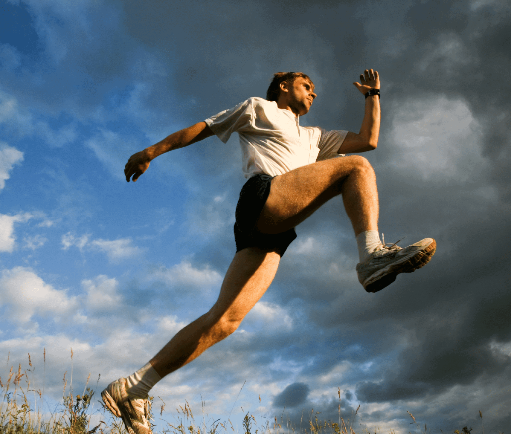man taking a running leap over an obstacle - anti-aging benefits of regenerative medicine